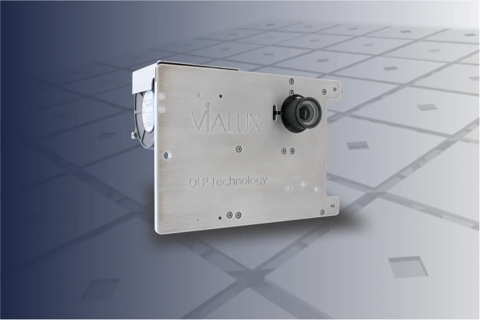 Industrial grade projection unit in a silver housing.