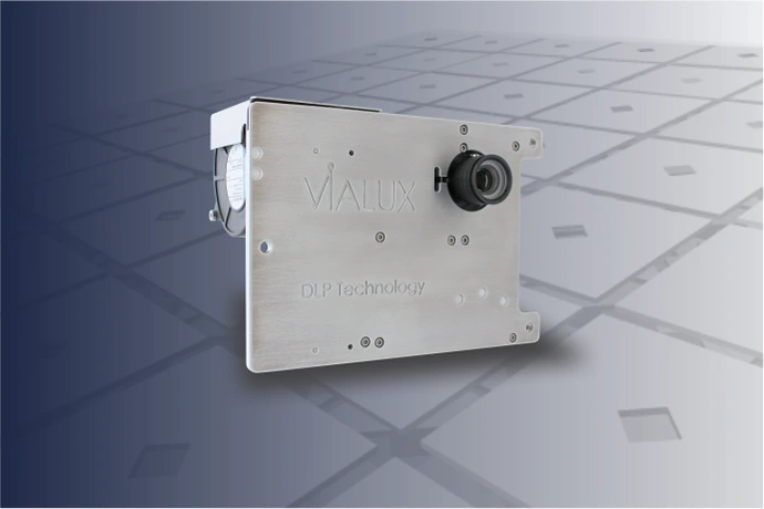 Industrial grade projection unit in a silver housing.